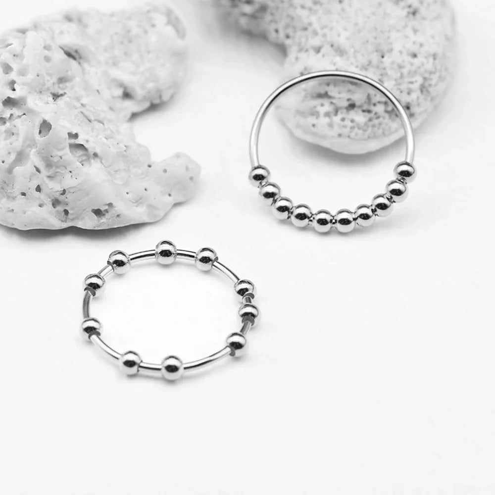 Pierścionek obrączka anty-stresowa z obracającymi się perełkami dla mężczyzn lub kobiet srebrny