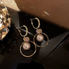 Kolczyk z perłą wiszącą