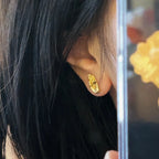 Kolczyki Sztyfty Ręka Buddy złote