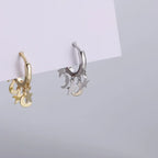 Kolczyki koła z zawieszkami w kształcie gwiazd i księżyców srebrne