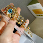 Kolczyki wiszące z niebieskim okiem i cyrkoniami