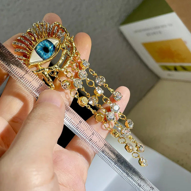 Boucles d'Oreilles Pendantes Oeil Bleu et Strass