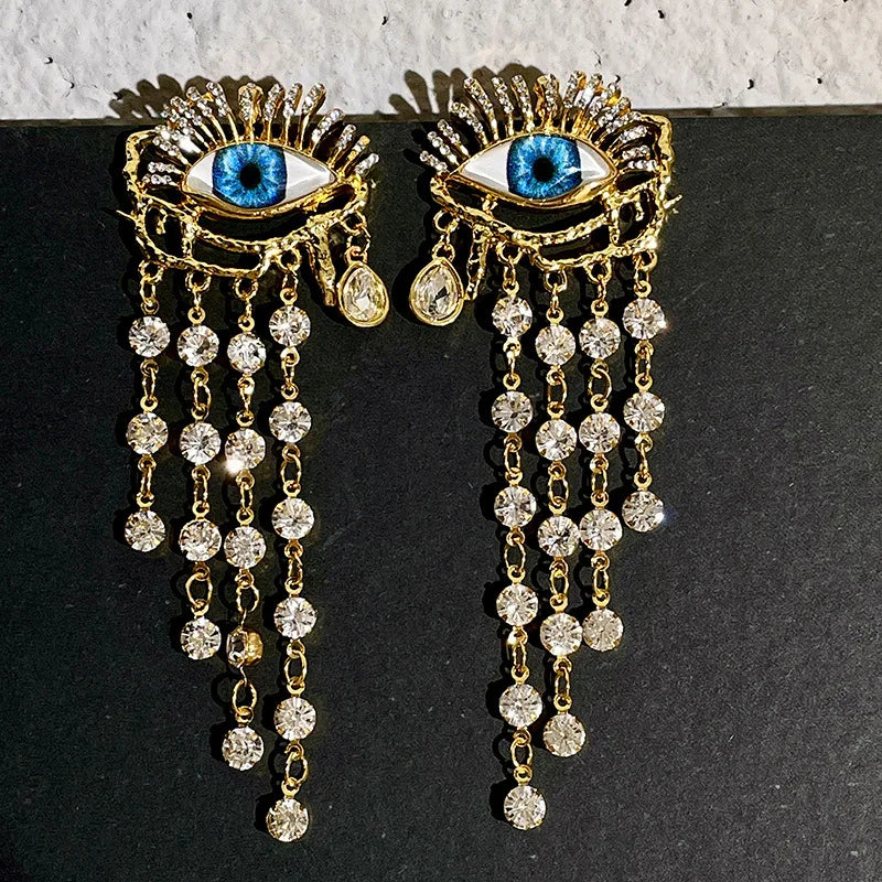Boucles d'Oreilles Pendantes Oeil Bleu et Strass