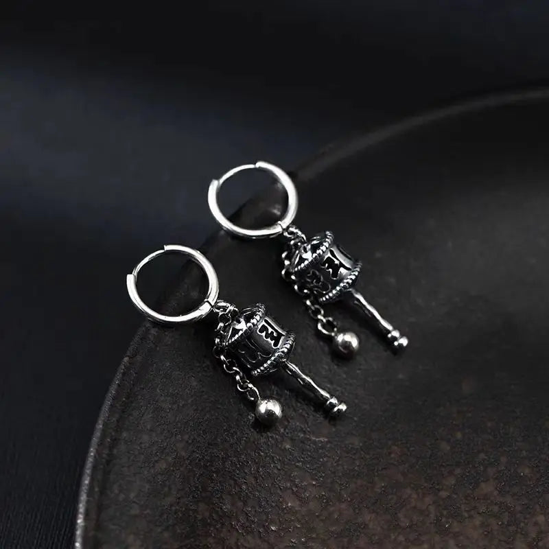 Kolczyki wiszące z buddyjskim kołem modlitewnym