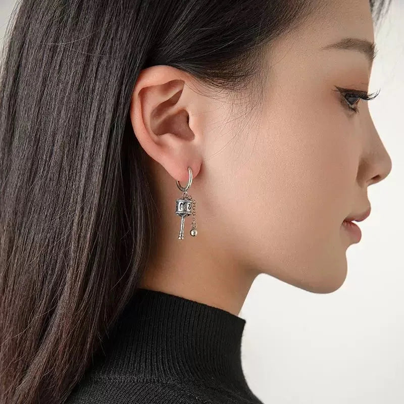 Kolczyki wiszące z buddyjskim kołem modlitewnym