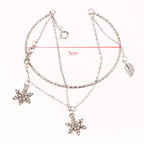 Podwójna bransoletka z kryształowymi płatkami śniegu