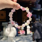 Bransoletka z perełkami z różowymi kwiatami