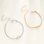 Bransoletka dla par z splotem węzła w kolorze złotym i srebrnym (zestaw 2 bransoletek)