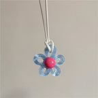 Naszyjnik z jasnoniebieskim kolorowym kwiatowym wisiorkiem