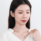 Naszyjnik z podwójnym wisiorkiem nieskończoności i cyrkonią w kolorze różowego złota