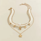 Naszyjnik wielowarstwowy z zawieszkami muszli i rozgwiazd