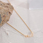 Naszyjnik z naturalnymi perłami złoty