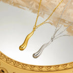 Naszyjnik z asymetryczną zawieszką w kształcie kropli wody, złoty