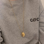 Długi naszyjnik z dużą kroplą wody w kolorze złotym