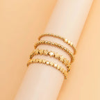 Zestaw 4 bransoletek z gwiazdkami w kolorze złotym